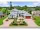 A home with a circular driveway on a golf course community at 2005 Country Club Dr, Port Orange, FL 32128