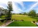 Well-maintained backyard with lush green grass and views of the pristine golf course at 2005 Country Club Dr, Port Orange, FL 32128