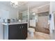 Modern bathroom featuring a glass-enclosed shower, stylish vanity, and elegant lighting fixtures at 2005 Country Club Dr, Port Orange, FL 32128