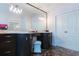 Bathroom vanity with marble floors, large mirror and ample storage in cabinets and drawers at 2005 Country Club Dr, Port Orange, FL 32128