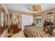 Eclectic bedroom featuring wood decor and a view to the landscaped backyard at 2005 Country Club Dr, Port Orange, FL 32128