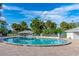 A picturesque community pool offers a refreshing escape, framed by swaying palms and inviting lounge seating under a sunny sky at 2005 Country Club Dr, Port Orange, FL 32128