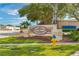 An inviting community sign welcomes visitors with manicured landscaping and a clear indication of the corporate center's location at 2005 Country Club Dr, Port Orange, FL 32128