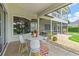 Charming covered patio featuring an outdoor dining area and scenic views of the backyard at 2005 Country Club Dr, Port Orange, FL 32128