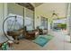 Inviting covered patio with comfortable seating and stylish decor, perfect for outdoor relaxation at 2005 Country Club Dr, Port Orange, FL 32128