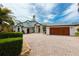 Lovely two-story home with beautiful landscape, paver driveway, and spacious three-car garage at 2005 Country Club Dr, Port Orange, FL 32128