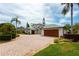 Beautiful two-story home with paver driveway, lush landscaping, and a spacious three-car garage at 2005 Country Club Dr, Port Orange, FL 32128