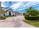 Charming two-story home with paver driveway, lush landscaping, and a grand entrance at 2005 Country Club Dr, Port Orange, FL 32128