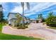 Beautiful two-story home with paver driveway, lush landscaping, and a spacious three-car garage at 2005 Country Club Dr, Port Orange, FL 32128