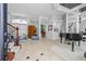 Bright foyer showcasing tile floors, an elegant staircase, and decorative lighting at 2005 Country Club Dr, Port Orange, FL 32128
