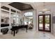 Grand foyer featuring a black piano, high ceilings, and large windows, creating an elegant and inviting entrance at 2005 Country Club Dr, Port Orange, FL 32128