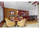Inviting game room featuring an octagonal table, bar area, and unique decor at 2005 Country Club Dr, Port Orange, FL 32128