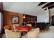 Charming game room featuring a wooden game table and a bar for seamless entertaining at 2005 Country Club Dr, Port Orange, FL 32128