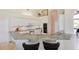 Spacious kitchen with modern appliances, granite countertops, and breakfast bar with seating at 2005 Country Club Dr, Port Orange, FL 32128