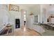 Bright kitchen featuring white cabinetry, stainless appliances, a breakfast bar, and an arched doorway to other rooms at 2005 Country Club Dr, Port Orange, FL 32128