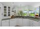 Gourmet kitchen showcasing granite countertops, modern appliances, and a view to the outside at 2005 Country Club Dr, Port Orange, FL 32128