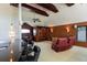 The living area has dark wood ceiling beams, a wet bar, and cozy seating area, perfect for entertaining at 2005 Country Club Dr, Port Orange, FL 32128