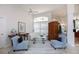 Cozy living room featuring comfortable seating, stylish decor, and a ceiling fan for added comfort at 2005 Country Club Dr, Port Orange, FL 32128