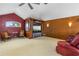 Cozy living room with vaulted ceilings, entertainment center, and ample seating at 2005 Country Club Dr, Port Orange, FL 32128