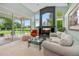 Spacious living room with bright natural light, comfortable furniture, and access to the outdoor patio at 2005 Country Club Dr, Port Orange, FL 32128