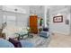 Comfortable living room with bright light, light blue chairs, and elegant accents and decor at 2005 Country Club Dr, Port Orange, FL 32128