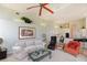 Open-concept living room with comfortable seating and seamless flow into the kitchen and dining areas at 2005 Country Club Dr, Port Orange, FL 32128
