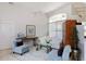Bright living room with plush seating, a ceiling fan, and ample natural light from large windows at 2005 Country Club Dr, Port Orange, FL 32128