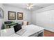 Cozy home office with wood floors, ample storage, and a white desk; perfect for studying or remote work at 2005 Country Club Dr, Port Orange, FL 32128