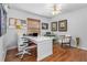 Comfortable office with wood floors, natural light, and a white desk; perfect for remote work at 2005 Country Club Dr, Port Orange, FL 32128