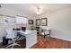 Well-lit office with hardwood floors, ceiling fan, desk, and storage for an ideal work environment at 2005 Country Club Dr, Port Orange, FL 32128