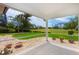 Tranquil screened-in patio featuring views of the lush, green golf course and surrounding trees at 2005 Country Club Dr, Port Orange, FL 32128