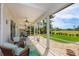 Open screened-in patio with golf course view, ideal for outdoor relaxing and entertaining at 2005 Country Club Dr, Port Orange, FL 32128