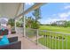 Covered patio boasts stunning views of the lush green golf course at 2005 Country Club Dr, Port Orange, FL 32128