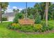 Well-maintained 'Country Club Estates' community sign surrounded by lush landscaping at 2005 Country Club Dr, Port Orange, FL 32128