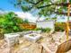 Inviting backyard features a stone fire pit and chairs for outdoor relaxation and entertaining at 216 Murray St, New Smyrna Beach, FL 32168