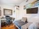 Bright bedroom features hardwood floors, a comfortable daybed, and a functional workspace with natural light at 216 Murray St, New Smyrna Beach, FL 32168