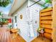 Stylish outdoor shower offers a private retreat with wood accents and garden views at 216 Murray St, New Smyrna Beach, FL 32168