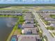 Picturesque aerial view of the neighborhood, highlighting the community's layout and surrounding landscape at 219 Venetian Palms Blvd, New Smyrna Beach, FL 32168