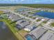 Picturesque aerial view of the neighborhood, highlighting the community's layout and surrounding landscape at 219 Venetian Palms Blvd, New Smyrna Beach, FL 32168