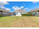 Expansive backyard with lush green grass, perfect for outdoor activities and entertaining guests at 219 Venetian Palms Blvd, New Smyrna Beach, FL 32168