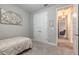 Another bedroom with a twin bed and closet for storage at 219 Venetian Palms Blvd, New Smyrna Beach, FL 32168