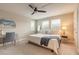 Bright bedroom with a ceiling fan, natural light, and a comfortable bed at 219 Venetian Palms Blvd, New Smyrna Beach, FL 32168