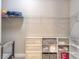 Organized closet with shelves and hanging racks, with storage solutions to keep your belongings in order at 219 Venetian Palms Blvd, New Smyrna Beach, FL 32168