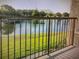 View from the Balcony with a serene view of a pond and trees in the background at 240 Villa Di Este Ter # 212, Lake Mary, FL 32746