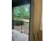 Balcony featuring an outdoor view with foliage and a black metal railing at 240 Villa Di Este Ter # 212, Lake Mary, FL 32746