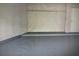 Unfinished basement with concrete floor and white walls, ideal for customization at 240 Villa Di Este Ter # 212, Lake Mary, FL 32746