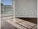 Bright bedroom with luxury vinyl plank flooring and large window at 240 Villa Di Este Ter # 212, Lake Mary, FL 32746
