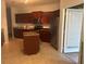 Kitchen with a breakfast island and granite countertops at 240 Villa Di Este Ter # 212, Lake Mary, FL 32746