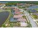 Aerial shot of home showing close proximity to lake and other homes in community at 254 Cappella Ct, New Smyrna Beach, FL 32168