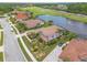 A lakefront home with fountain view and manicured landscaping in golf course community at 254 Cappella Ct, New Smyrna Beach, FL 32168